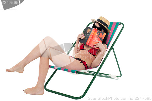 Image of Bikini lady hiding her face with a book