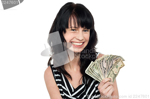 Image of Smiling pretty girl with cash