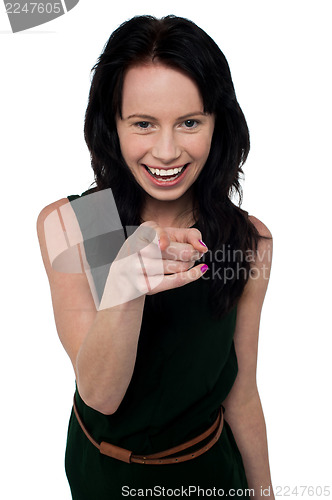 Image of Pretty girl in trendy wear pointing you out