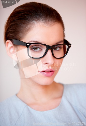 Image of Young attractive business woman with glasses
