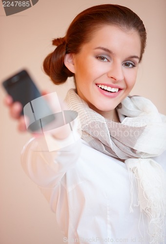 Image of Brunette woman with mobile phone