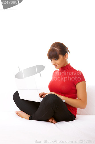 Image of Girl with laptop on couch