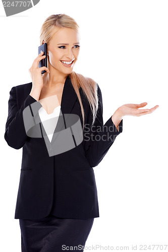 Image of Happy blond business woman using her mobile
