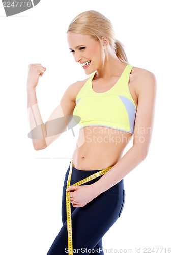 Image of Happy sporty woman showing her muscle