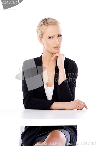 Image of Adorable blond business woman sitting at desk