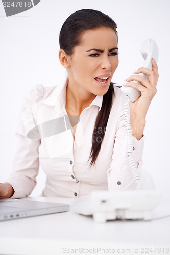 Image of Woman yelling on somebody over telephone