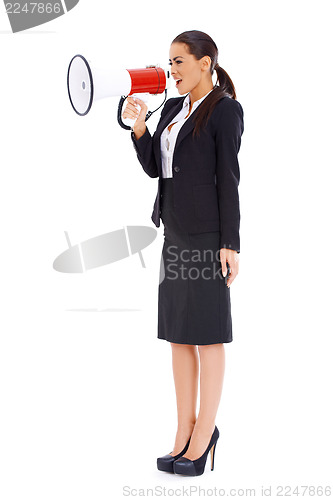 Image of Business woman screaming loudly thru big megaphone