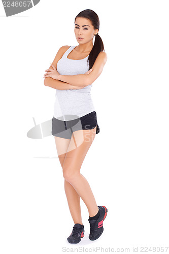 Image of Sexy fitness woman posing on white