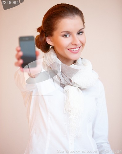 Image of Brunette woman with mobile phone