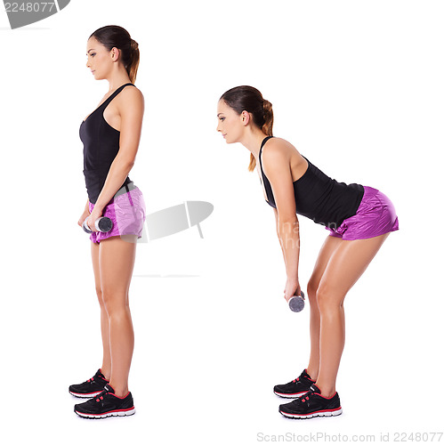 Image of Woman working out with barbells