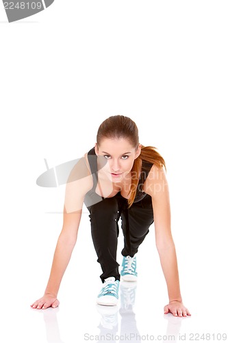 Image of Beautiful fitness woman doing stretching exercise