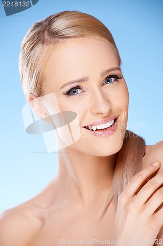 Image of Gorgeous woman portrait on blue