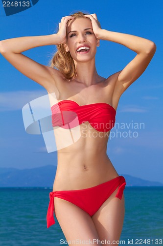 Image of Beautiful woman in red bikini