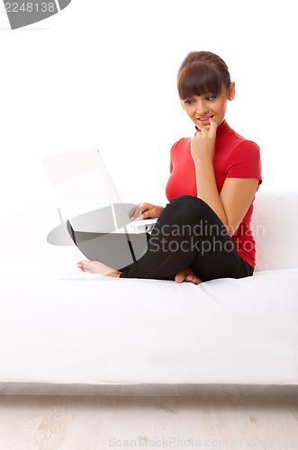 Image of Girl with laptop on couch