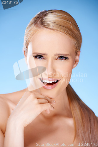 Image of Gorgeous woman portrait on blue