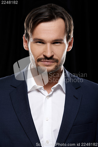 Image of Portrait of a confident happy young man