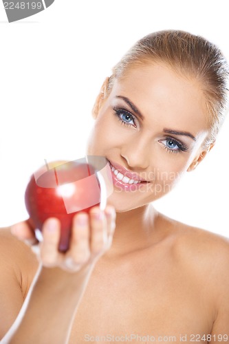 Image of Smiling beauty holding red apple