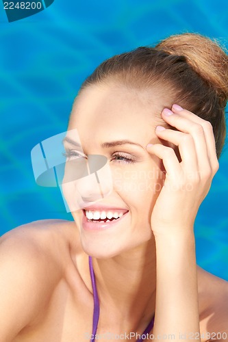 Image of Close up of adorable woman in swimming pool