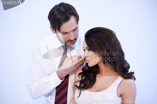 Image of Loving man stroking a womans cheek