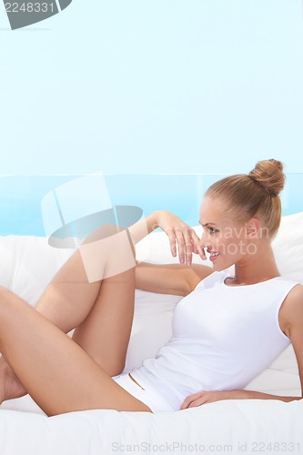 Image of Laughing woman in panties and shirt