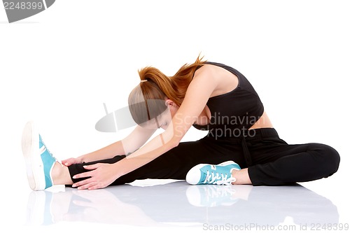 Image of Beautiful fitness woman doing stretching exercise