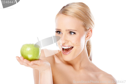 Image of Happy and healthy woman holding apple