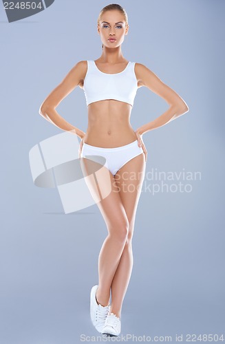 Image of Attractive young woman with perfect body in white underwear