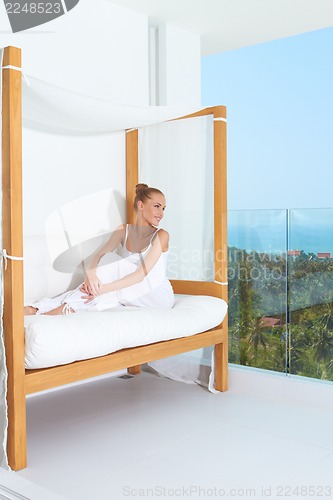 Image of Woman enjoying tropical luxury