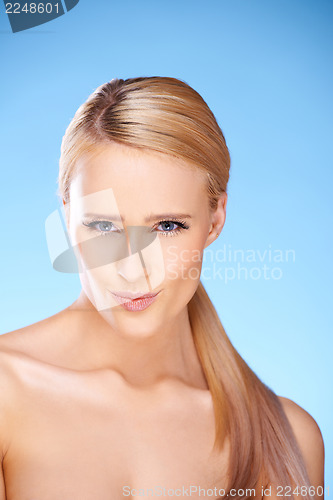 Image of Beautiful girl with big smile on blue