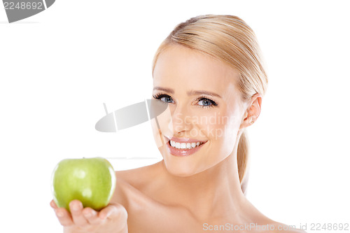 Image of Adorable and healthy woman holding apple