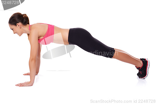 Image of Fit woman doing press ups