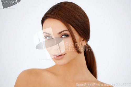 Image of Sensual brown haired woman with bare shoulders