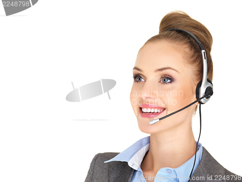 Image of Pretty female businesswoman talking headset
