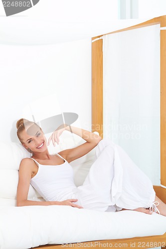 Image of Woman enjoying tropical luxury