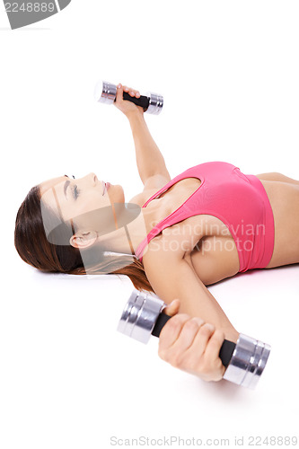 Image of Woman working out using dumbbells