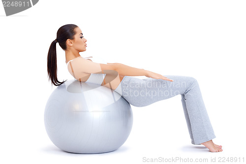 Image of Doing abdominal muscles with fitness ball