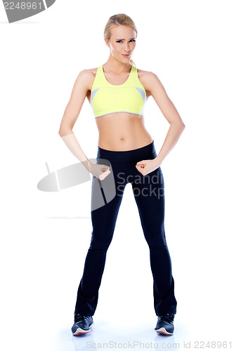 Image of Sporty blond girl showing her muscles