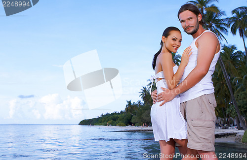 Image of Couple nex to Palm tree