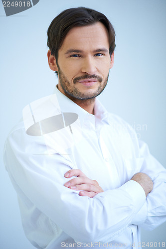 Image of Smiling man in shirtsleeves