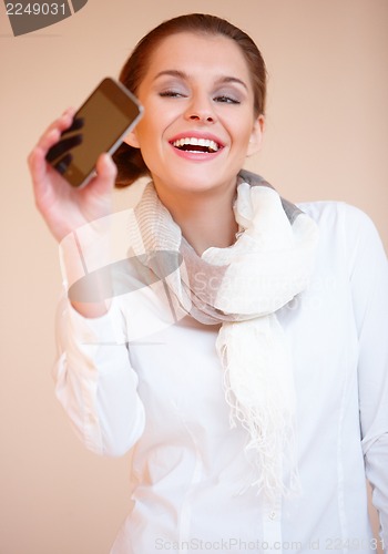 Image of Brunette woman with mobile phone