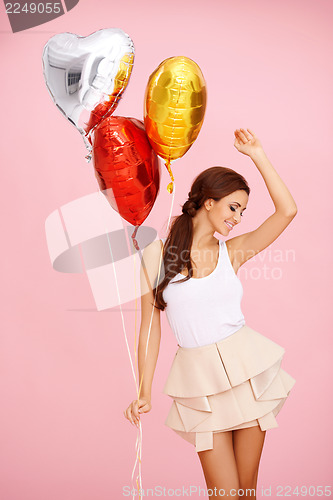 Image of Dancing brunette with balloons