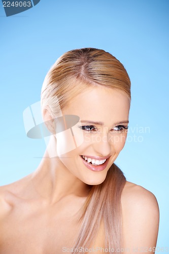 Image of Gorgeous woman portrait on blue