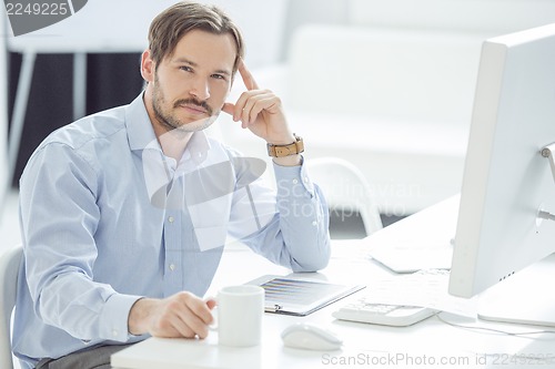 Image of Handsome Businessman working at his desk