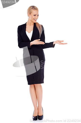 Image of Beautiful blond business woman presenting copy space