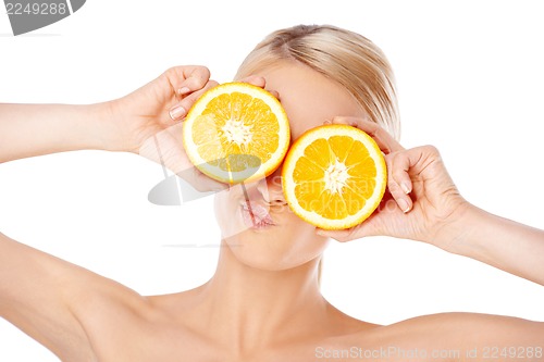 Image of Blond woman making glasses with orange halfs