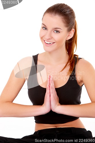Image of Portrait of pretty young woman doing yoga