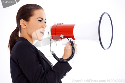 Image of Business woman screaming loudly thru big megaphone