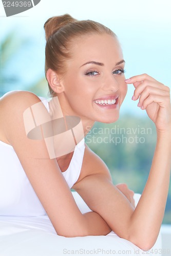 Image of Beautiful high-spirited woman laughing