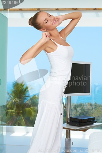 Image of Elegant shapely woman stretching