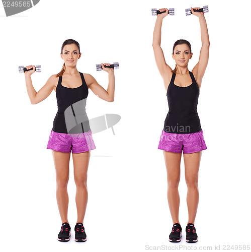 Image of Woman working out with dumbbells in a gym